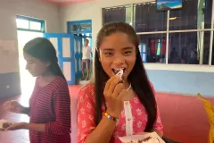 Nepal-girls-eating-cake-12-2024-07-13-at-1.09.39-PM