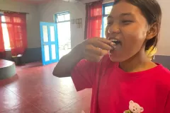 Nepal-girls-eating-cake-7-2024-07-13-at-1.09.37-PM-1